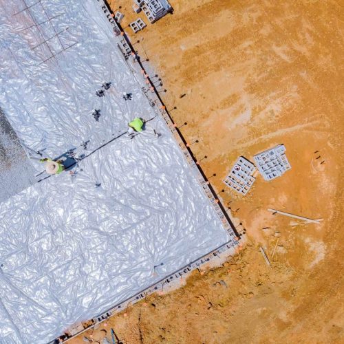 To ensure the waterproofing of the foundation, polyethylene is laid before the concrete is poured